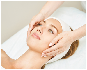 Face massage at spa salon. Doctor hands. Pretty female patient. Beauty treatment. Healthy skin procedure. Young woman head. Light background. Scrub rejuvenation. Facial dermatology mask. Detox therapy