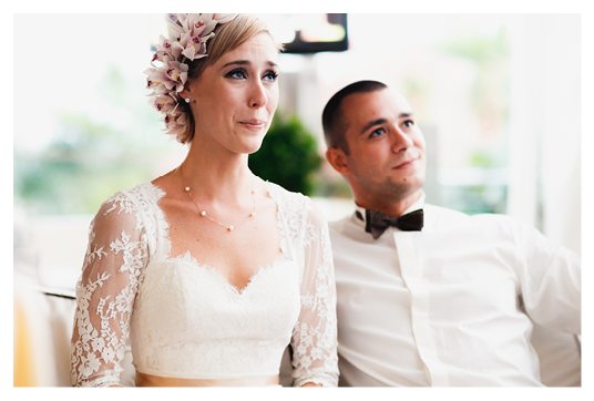 beautiful gorgeous blonde bride crying and stylish groom celebrating wedding on the restaurant terrace