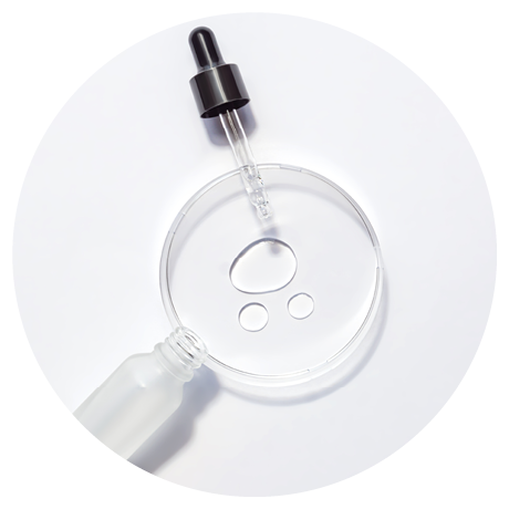 Cosmetic pipette serum on a petri dish on white background. Cosmetology and pharmaceuticals concept. Acid peeling, face oil, collagen.