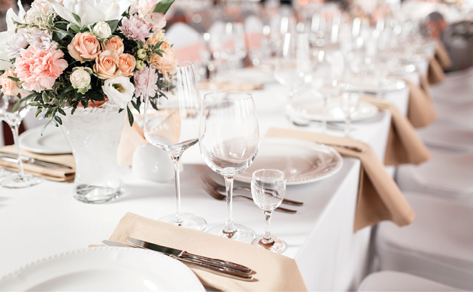 Tables set for an event party or wedding reception. luxury elegant table setting dinner in a restaurant. glasses and dishes.