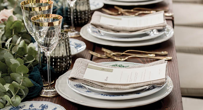 Place setting with menu and name card at elegant shabby chic table