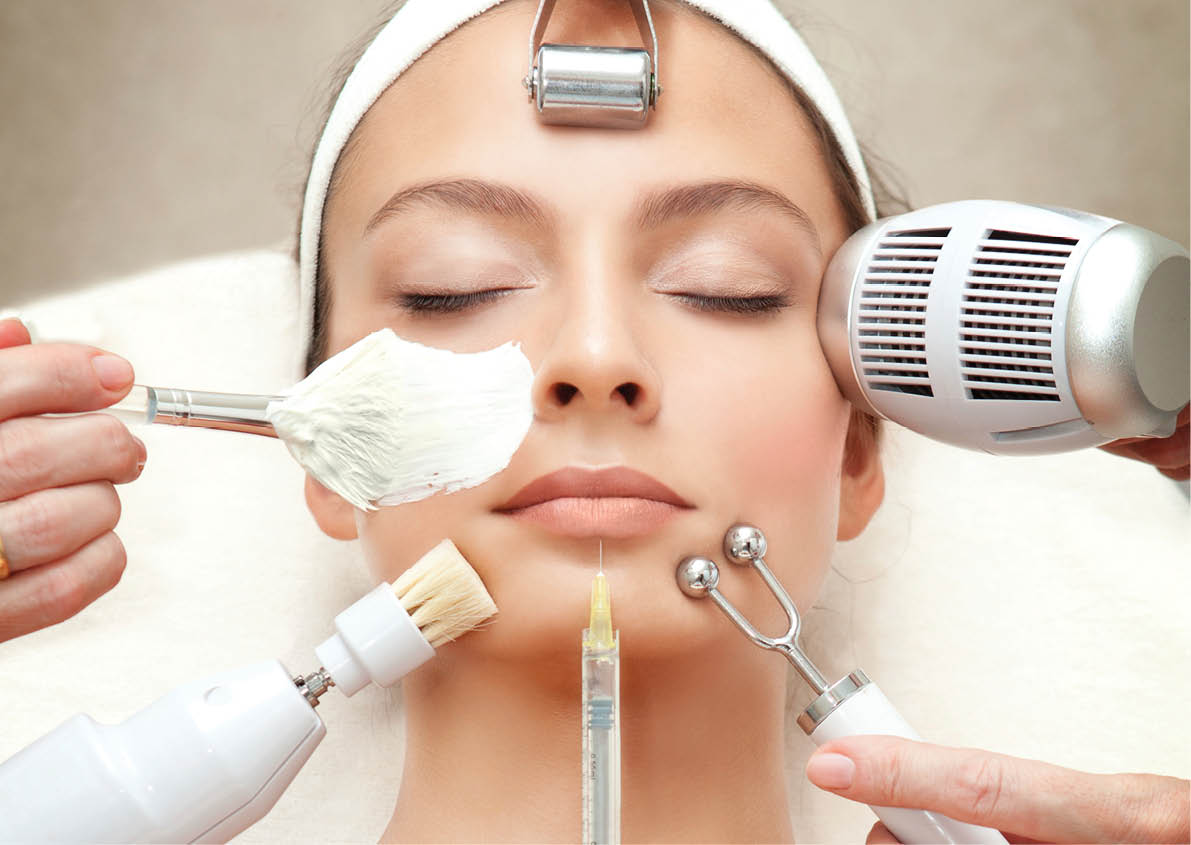 Spa Salon: Young Beautiful Woman Having Different Facial Treatment