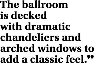 The ballroom is decked with dramatic chandeliers and arched windows to add a classic feel  