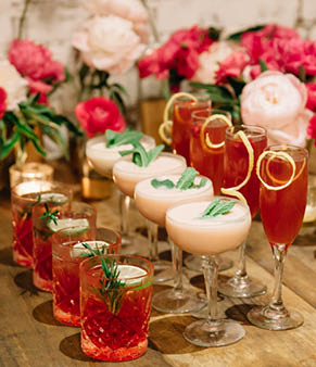 A celebration designed in pink colors with alcoholic drink complementing the party theme