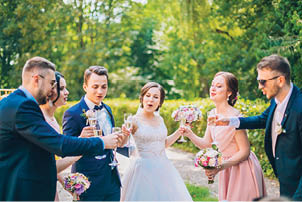 Bride and groom with happy groomsmen and bridesmaids having fun and popping champagne, newlyweds wedding hilarious moment  Funny momen  Crazy wedding people  