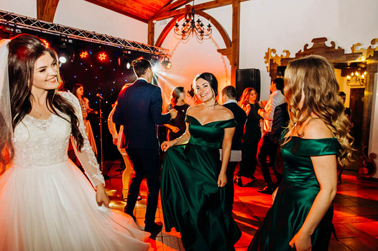 Wedding celebration  The bride and her friends dance on the dance floor