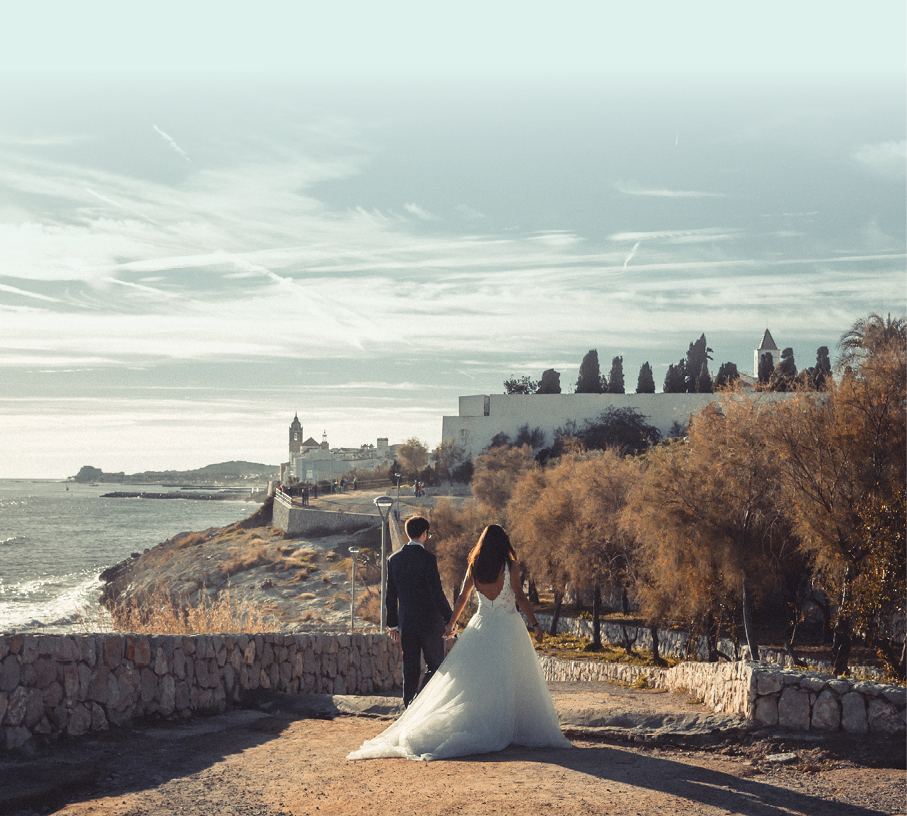 Couple Just Married Holding hands Mediterranean wedding Sitges Spain 