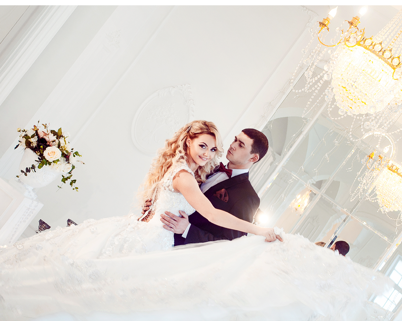 Beautiful young couple, bride and groom  Luxurious light interior