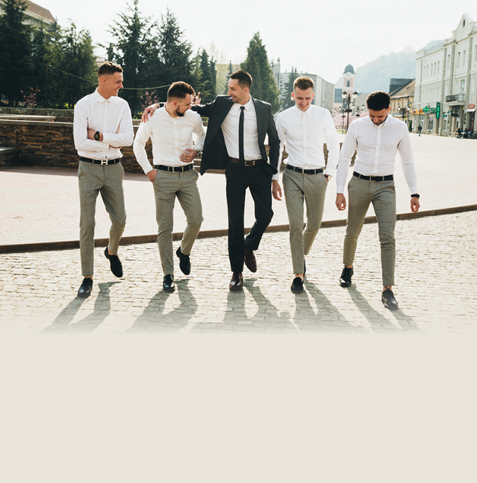 Wedding. Wedding day. Groom with groomsmen walking after wedding ceremony. Handshakes. Groom with friends at wedding day 