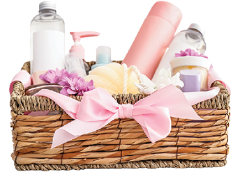 Gift basket with cosmetics on light wooden background