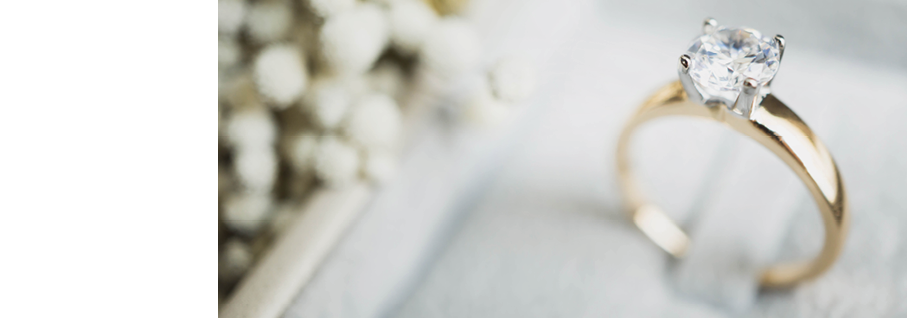 Close up of elegant diamond ring in the box with white flower background  soft and selective focus love and wedding concept 