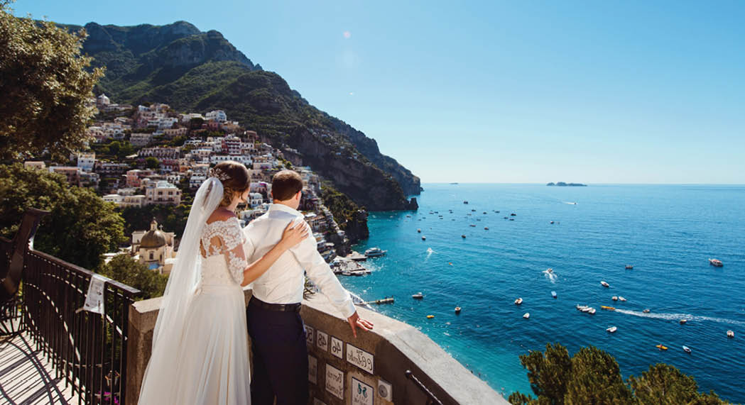 Tender romantic young couple in honeymoon in Positano, Amalfi coast, Italy