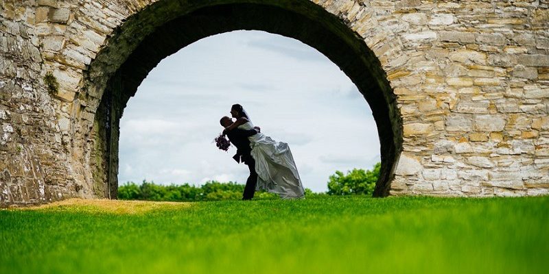 Groom lifts bride