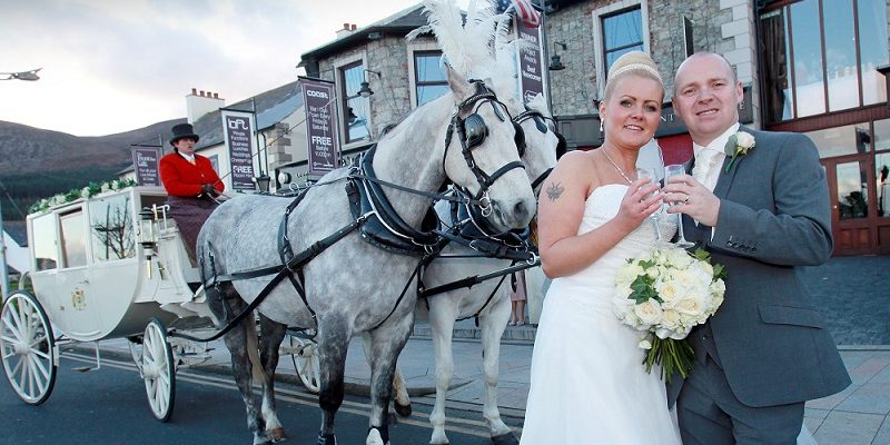 couple and horse drawn cart