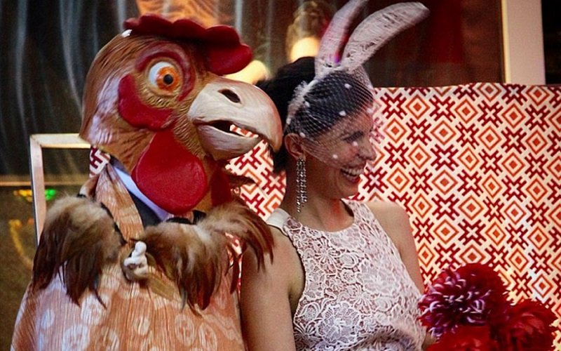 The groom wore a chicken head and the bride wore bunny ears
