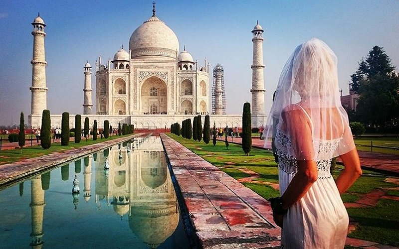 Heartbroken bride travels the world in her wedding dress