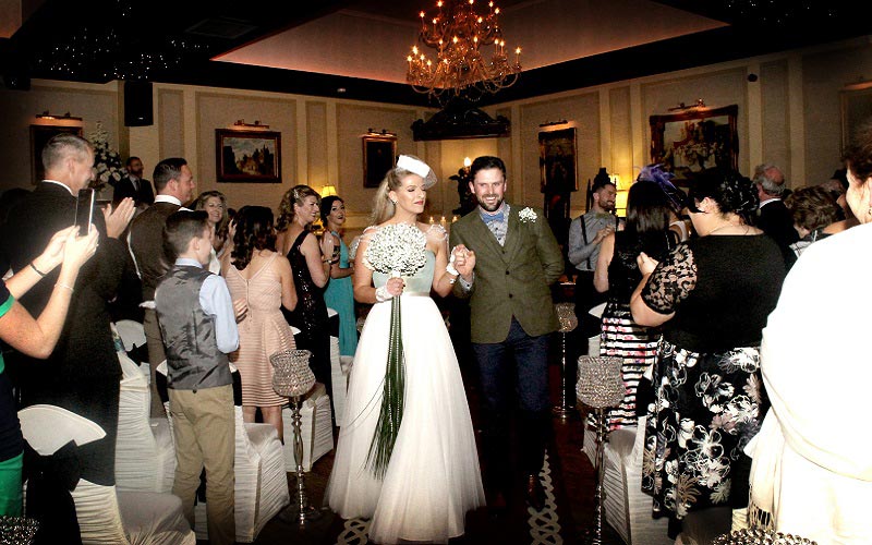 bride and groom walking down aisle