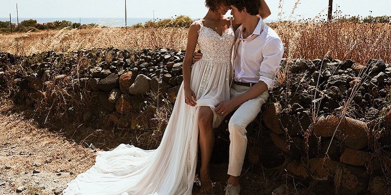 boho bride and groom embracing