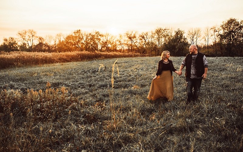 bride and groom in a field