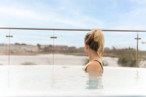 Girl in outdoor hot tub at Galmont Hotel & Spa, Galway